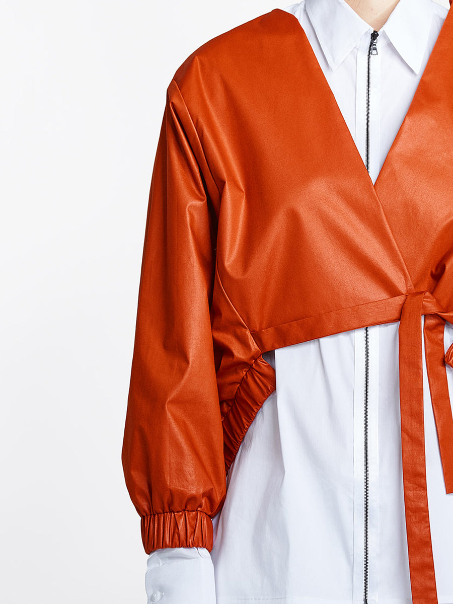 Burnt orange jacket on model detail
