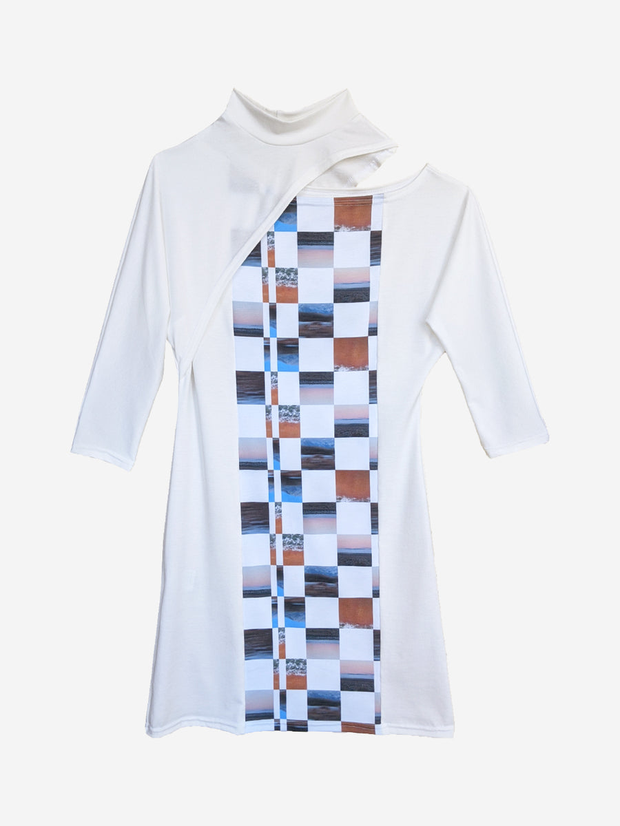 White jersey designer dress with split dolman sleeves, original print, and mock turtleneck.