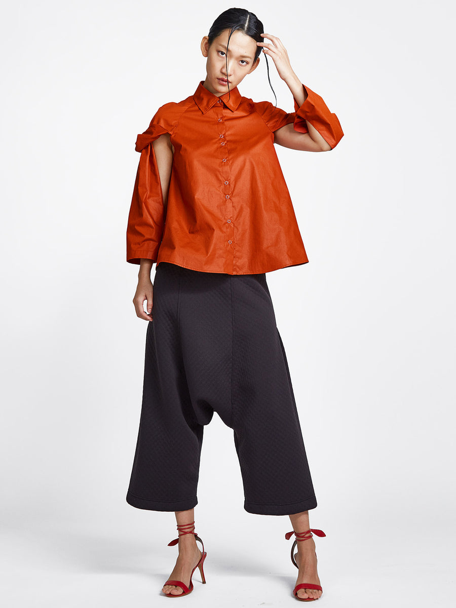 burnt orange topsy turvy shirt with exposed arms