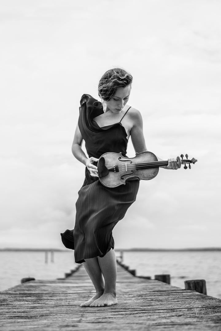 Violinist Audrey Wright performs in a set of NOT dresses