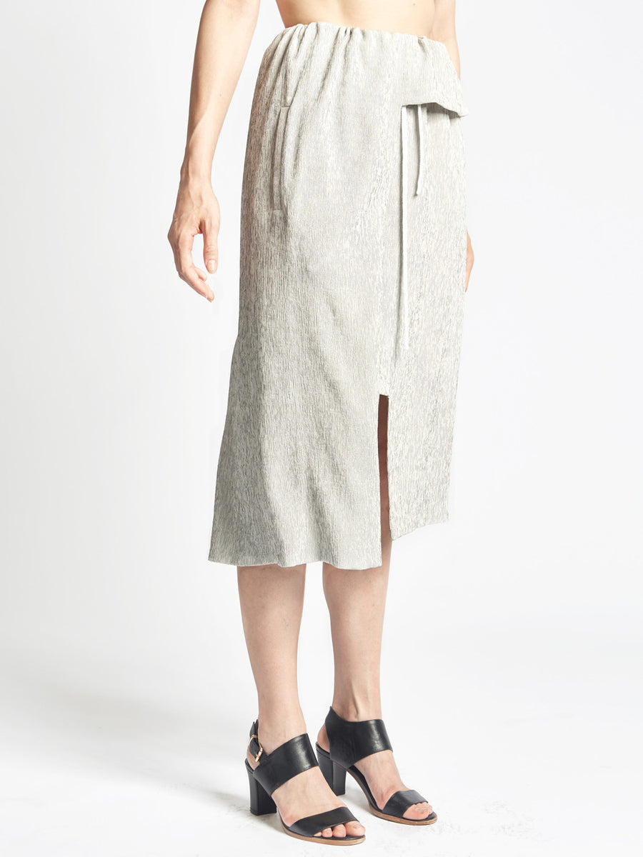 Gray silk micropleated overlap skirt with drawstring waist and pockets