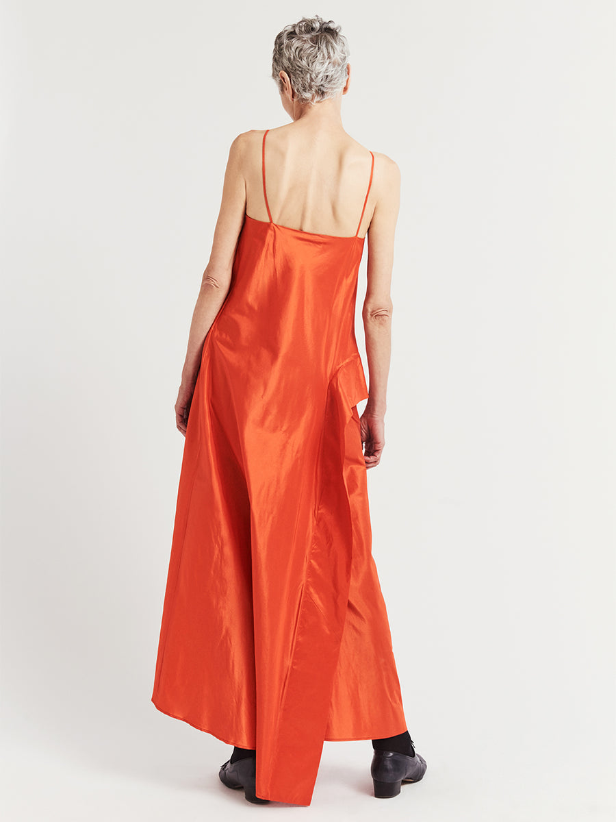 Back view of bright orange silk taffeta asymmetric long evening dress