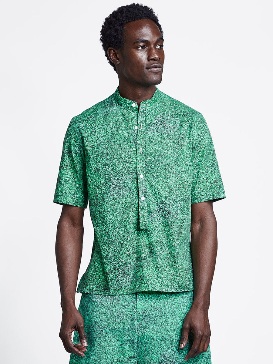 Loop placket short sleeve men's shirt in green print on model